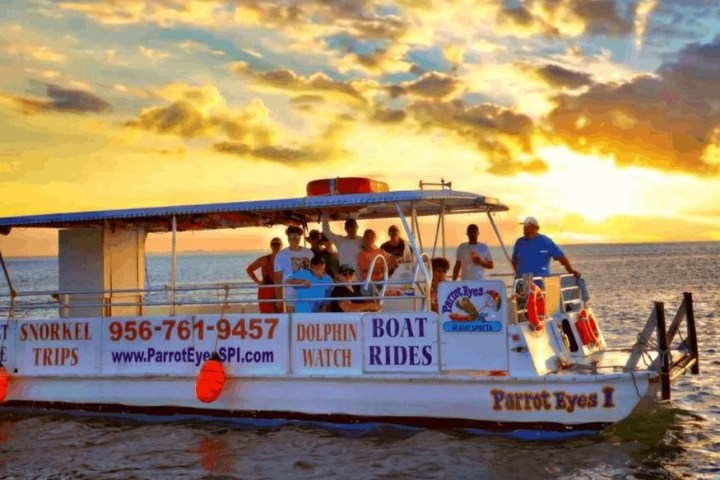 a group of people in a boat on a body of water