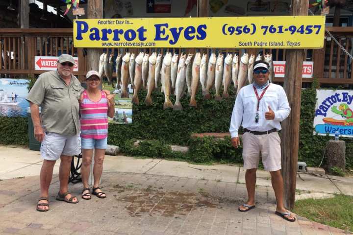 a group of people standing in front of a building