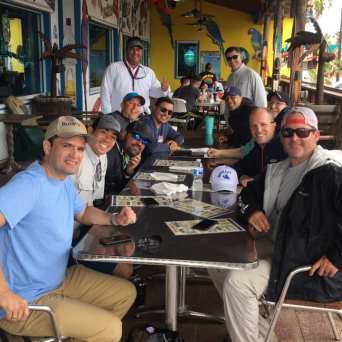 a group of people sitting at a table in a restaurant
