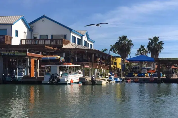 a boat is docked in front of a house