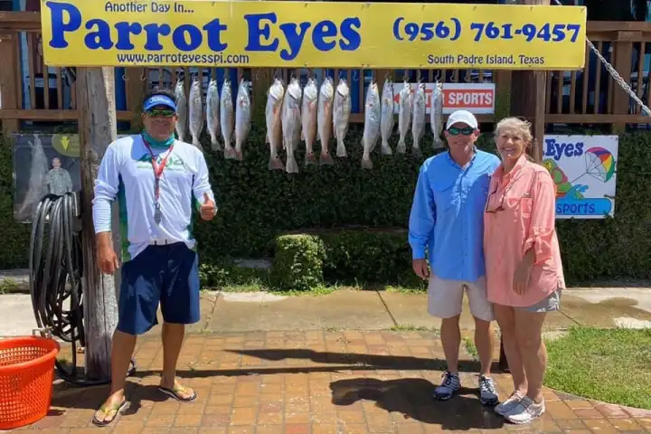 a group of people standing in front of a store