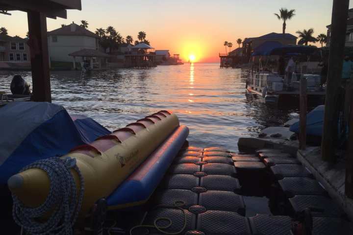 a boat that is sitting on a dock next to a body of water