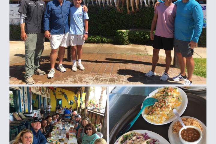 a group of people standing around a table
