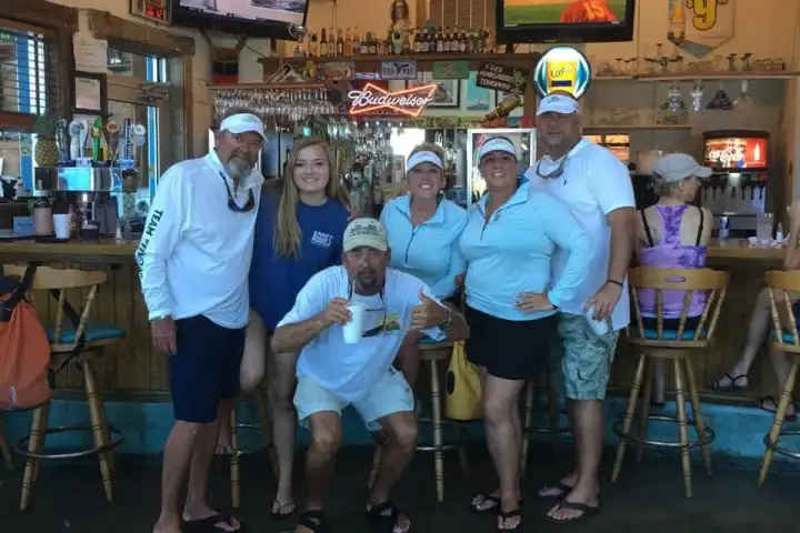 a group of people standing in front of a store